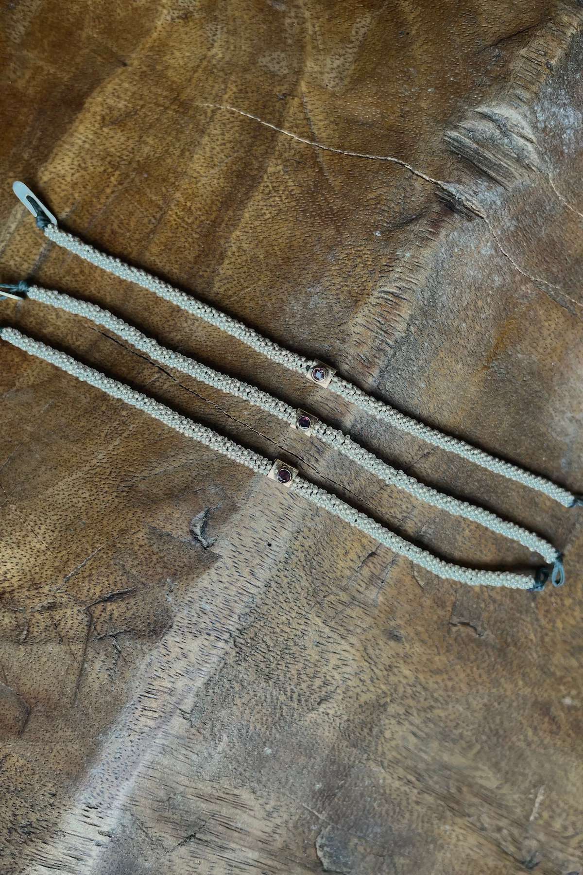 Nafsu - Bracelet w/gold square pendant I Purple stone